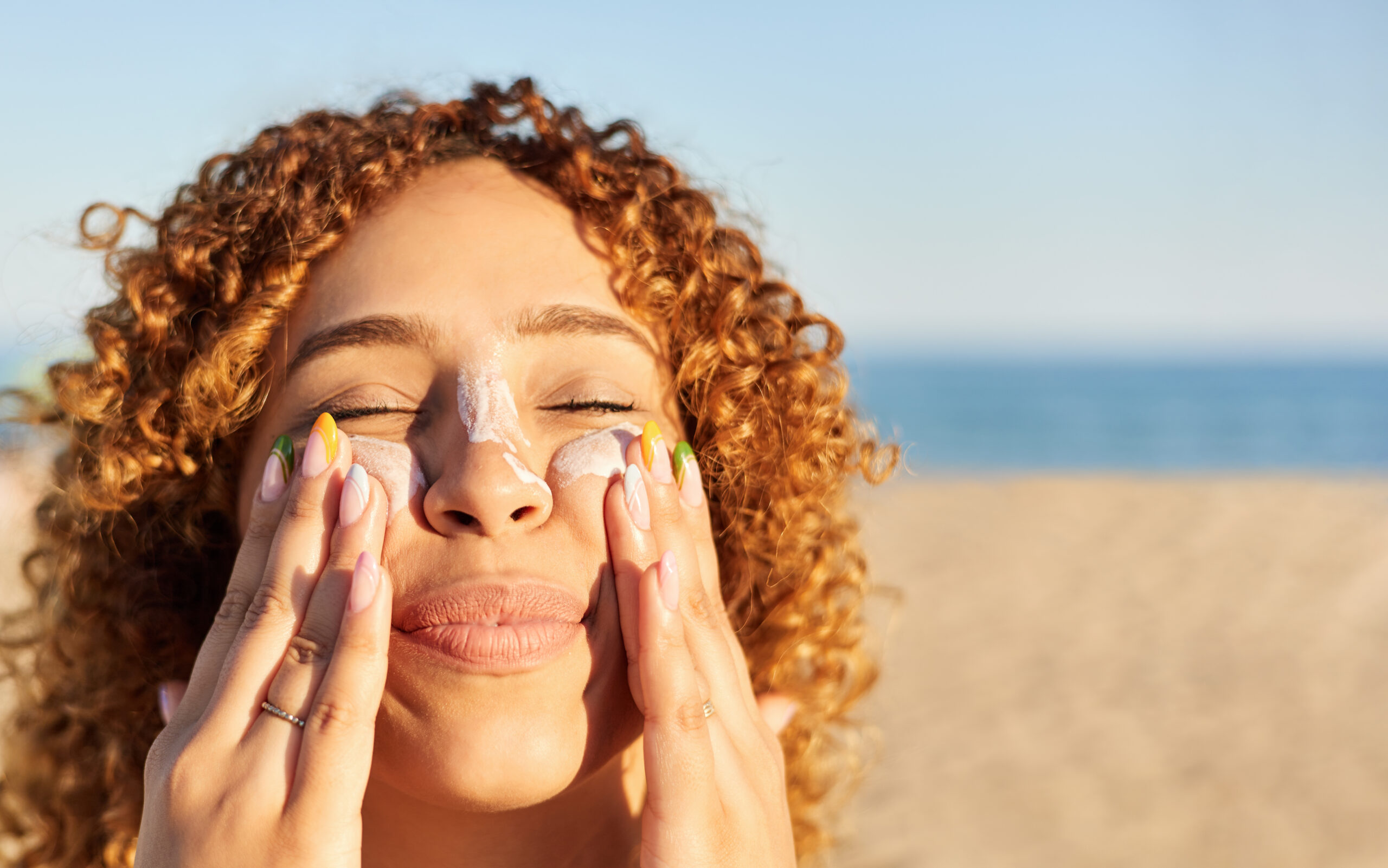 woman with sunscreen on face